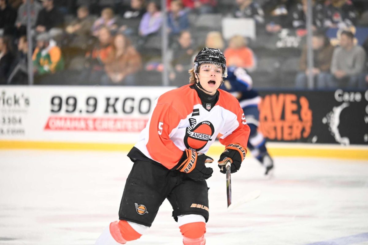 Mario Fate calls out to his Lancer's teammate during a face off with another team in the USHL. (Photo courtesy of Fate family.) 