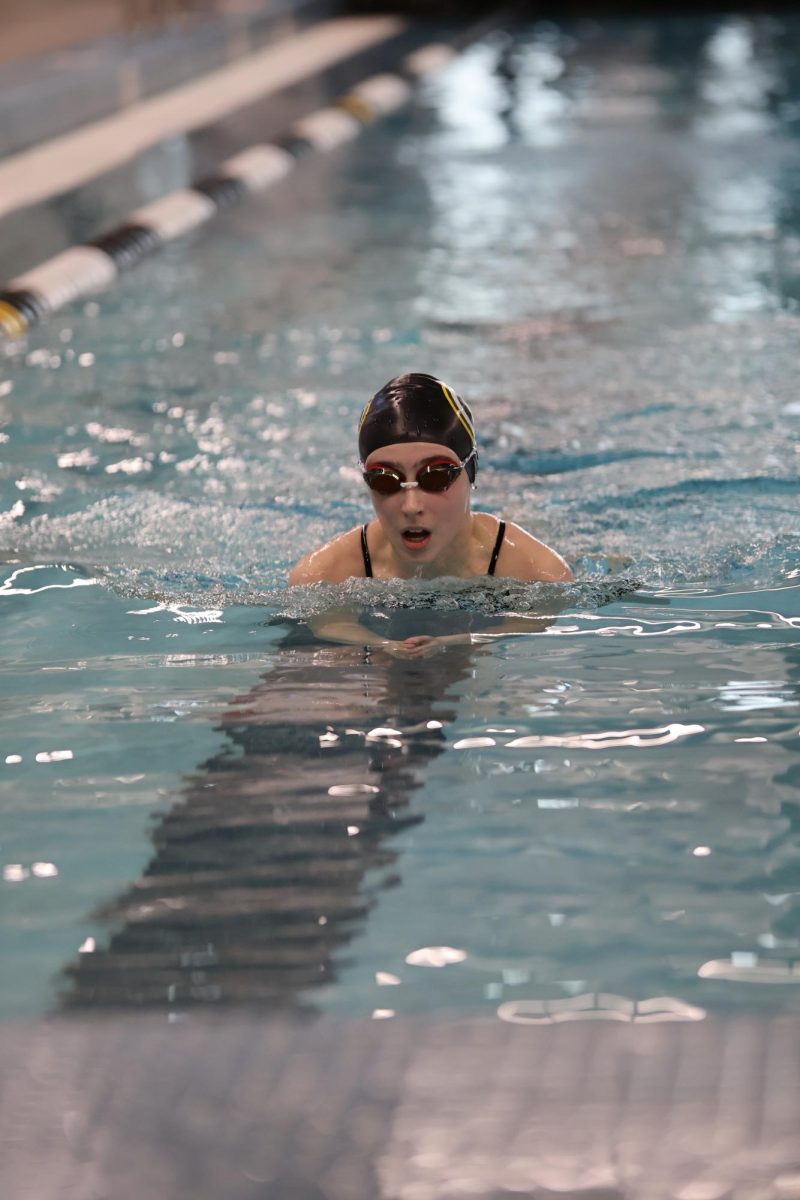 Sweeney finishes off a 25-yard relay of breaststroke. 