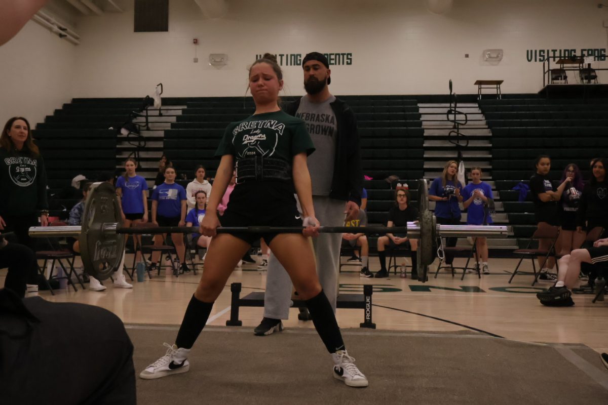 Sophomore Haleigh Kobielush pauses at the top of her 150 pound deadlift attempt, succeeding after previously failing to lift the same weight. Kobielush placed second in her weight class.