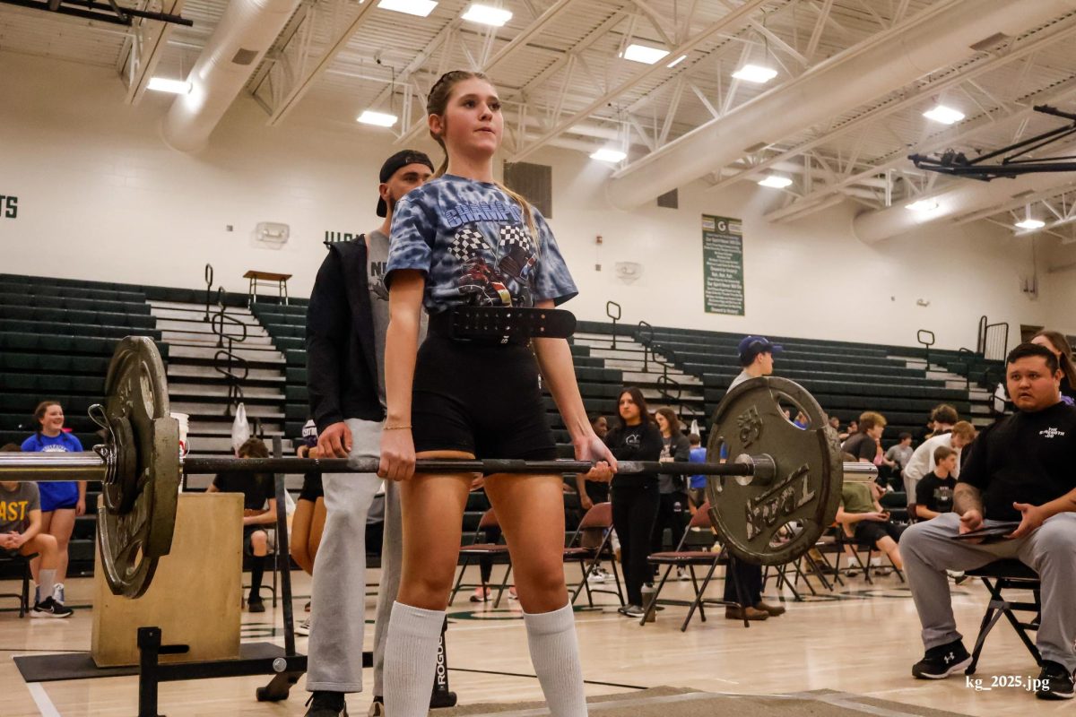 Sophomore Cheyenne Royer pauses at the top of her deadlift while lifting 145 pounds at the GHS meet. Royer placed second in her weight class.