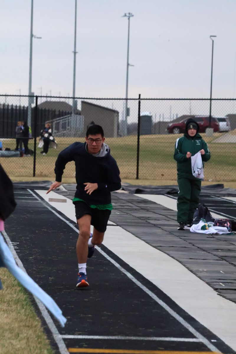 Junior student Nixon Hermeling gets a running start for his long jump attempt for the GEHS unified track meet.