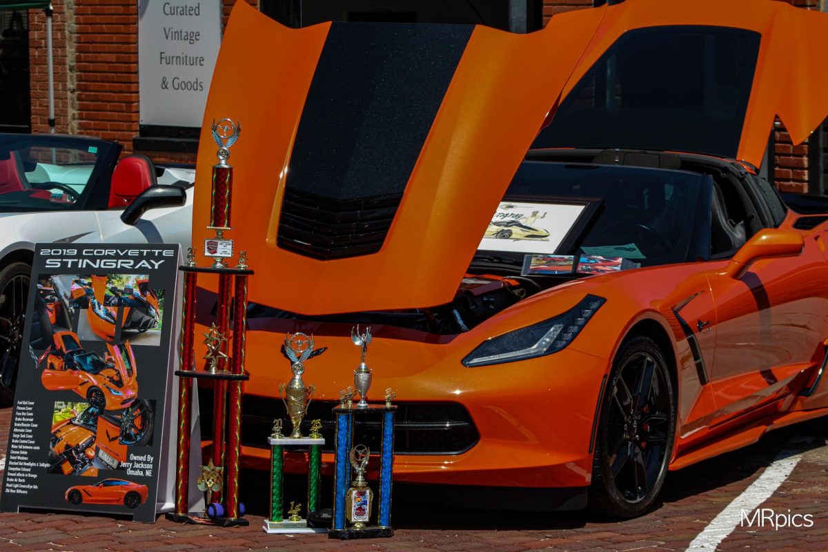A 2019 Stingray Corvette, owned by Jerry Jackson, sits in downtown Gretna while sporting several trophies.