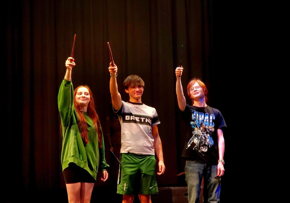 Sophomores Miah Lindquist, Liam Ruff and Sawyer Long wave their wands as they practice and perfect the show three days before the performance. "Puffs" opens this Friday, Aug. 22. 