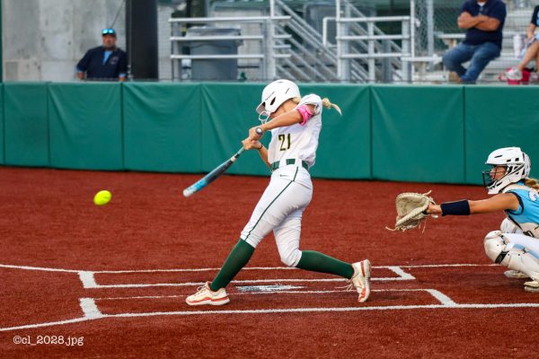 Senior Emerson Boyer makes contact and hits a ground ball to left side of the infield on Sept. 22.