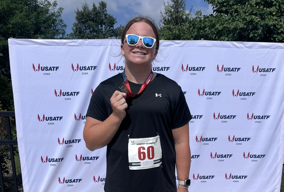 Andie Yost poses with her 3rd place medal for shot-put about an hour after she finished competing in the regional event. Photo courtesy Nikki Yost. 