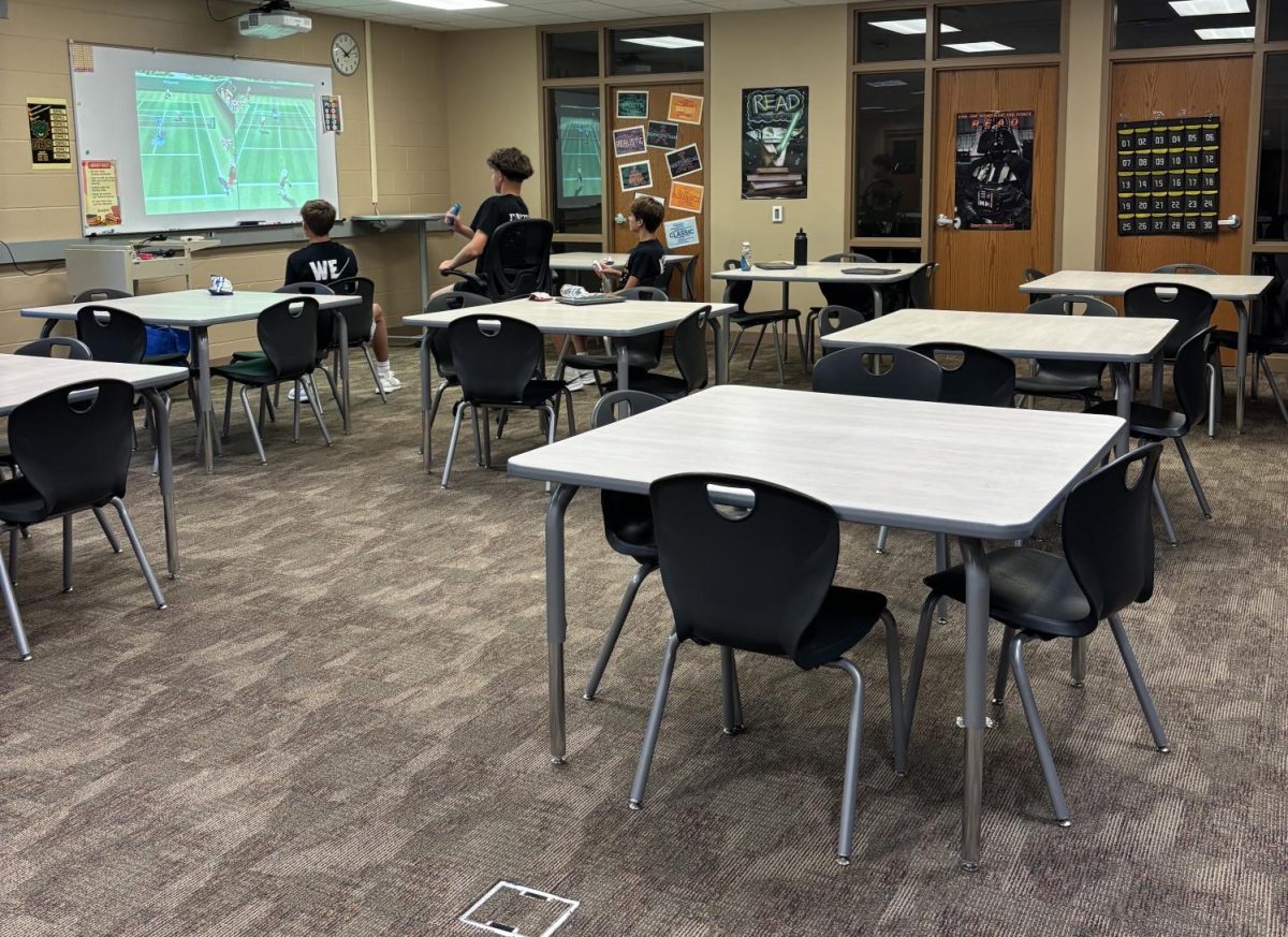 During a study hall, three freshmen, are hanging out in the library playing a game.