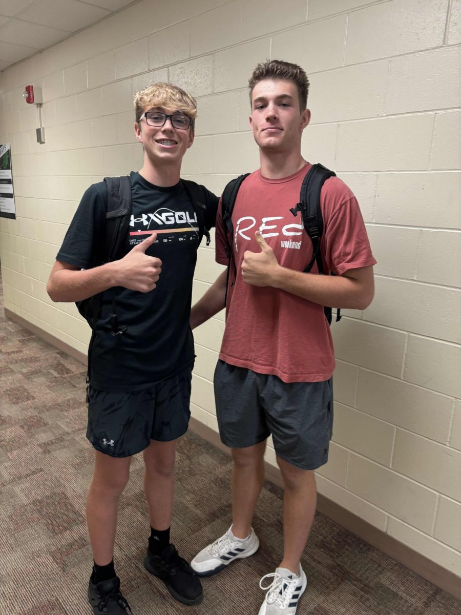 Senior Carter Cerny and freshman Callum Cerny smile because the are in the same school again.