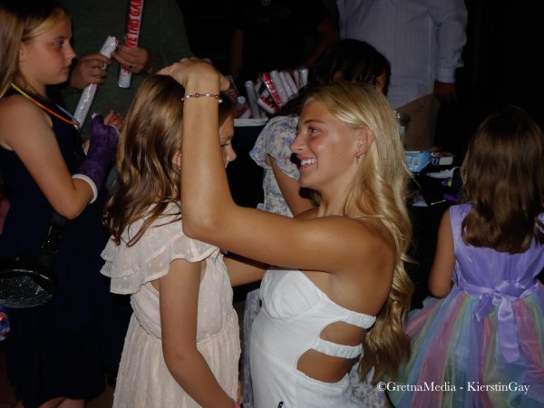 Senior Ava Honeyman with a participant at last year's Sweetheart Dance. The event is a fundraiser for the Dance Team. 