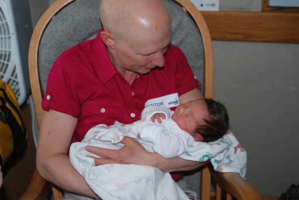 Susan Norder holding Claire Palser after she her brith in 2010. Norder was undergoing breast cancer treatment at the time. Photo courtesy of Stacia Palser