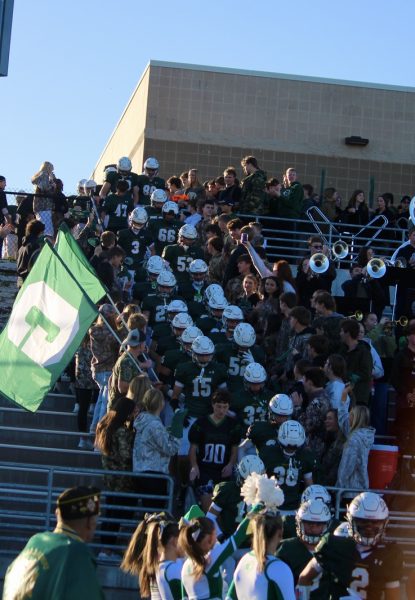 The band, dance team and Green Army welcome the GHS football team to the field to take on York.