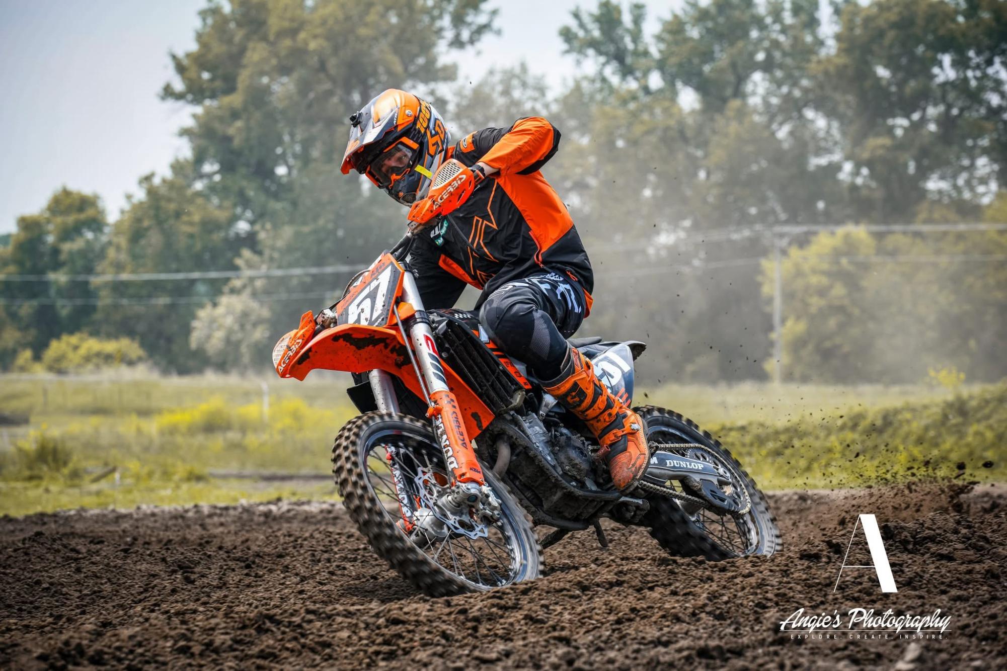 Senior Brewer Hinze gets down in the dirt for a turn, whipping around the corner. "My best memory from riding is when I won the Nebraska State Championship last year for my age group," Hinze said. Photo courtesy of Angie Photography.