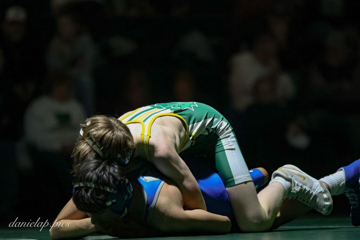 Freshman Dalton Dehart maintains top control, staying balanced and focused as he works to keep his opponent grounded and limit movement.