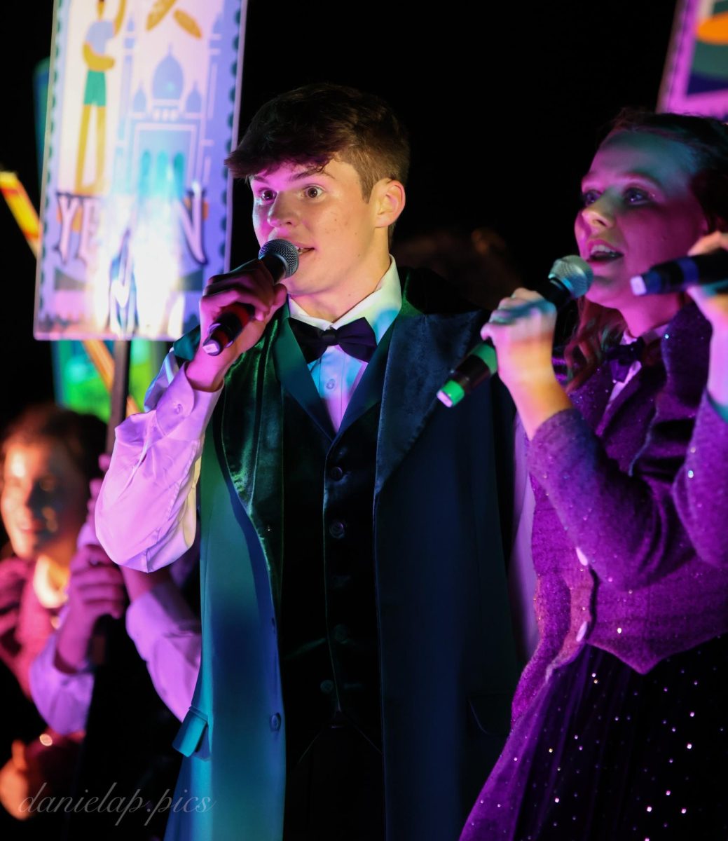 Senior Charlie Otto sings as part of a quartet during Revolution's show.  Show choir competition season runs through March.