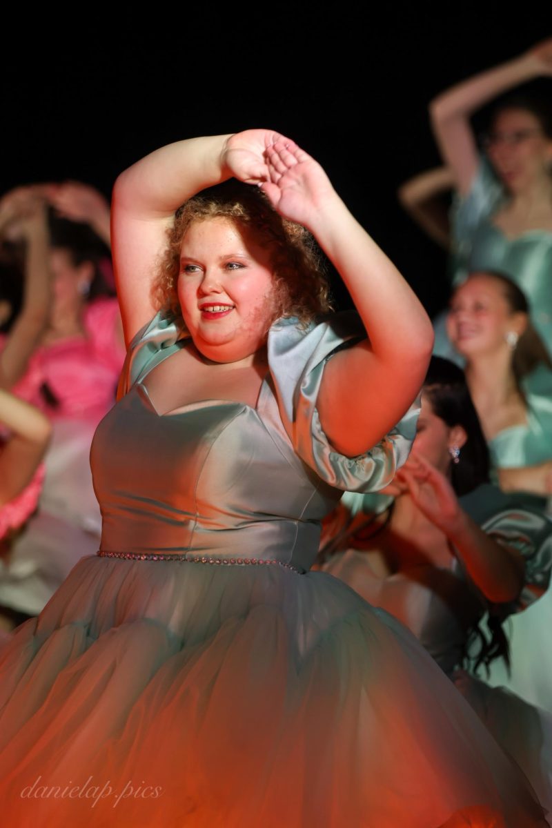 Junior Maya Parsons smiles while dancing at the premiere of Evolution.