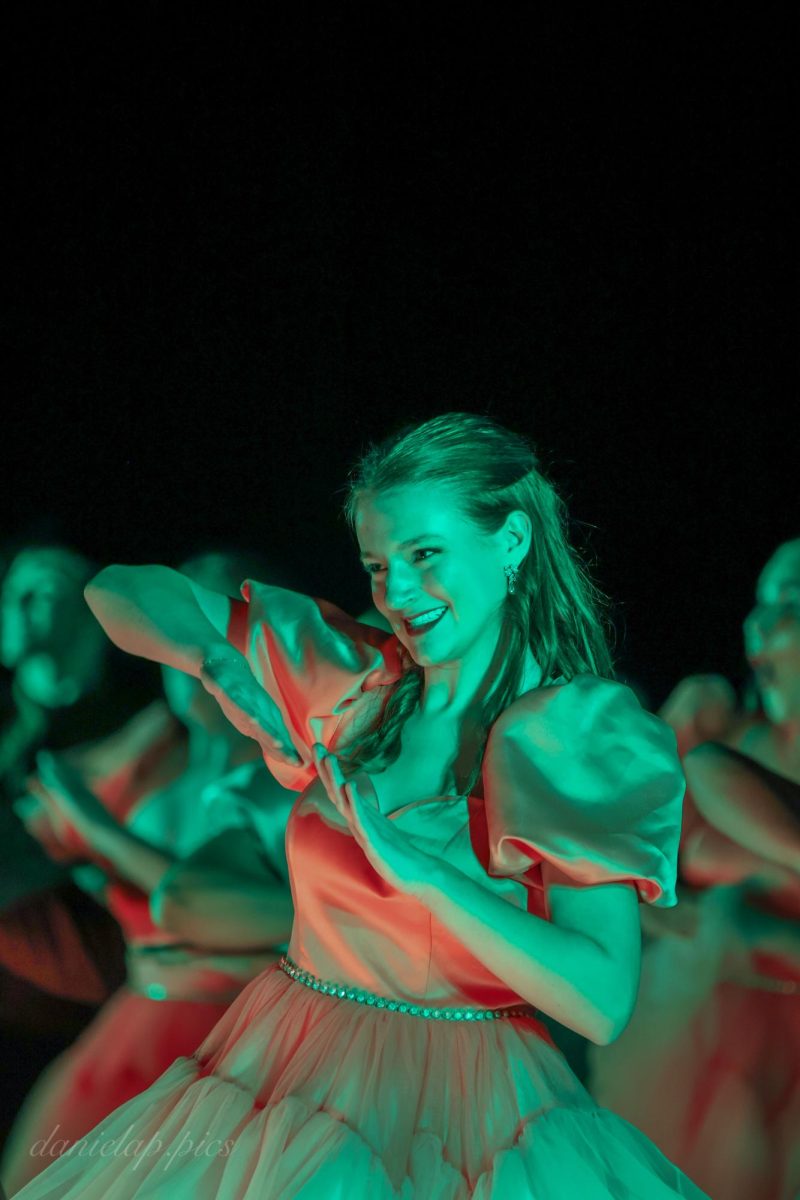 Freshman Josephine Berring smiles while performing with Gretna’s Evolution.