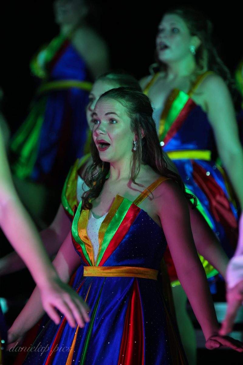 Senior Mia Glatter dances expressively in the back half of Evolution’s premiere performance.