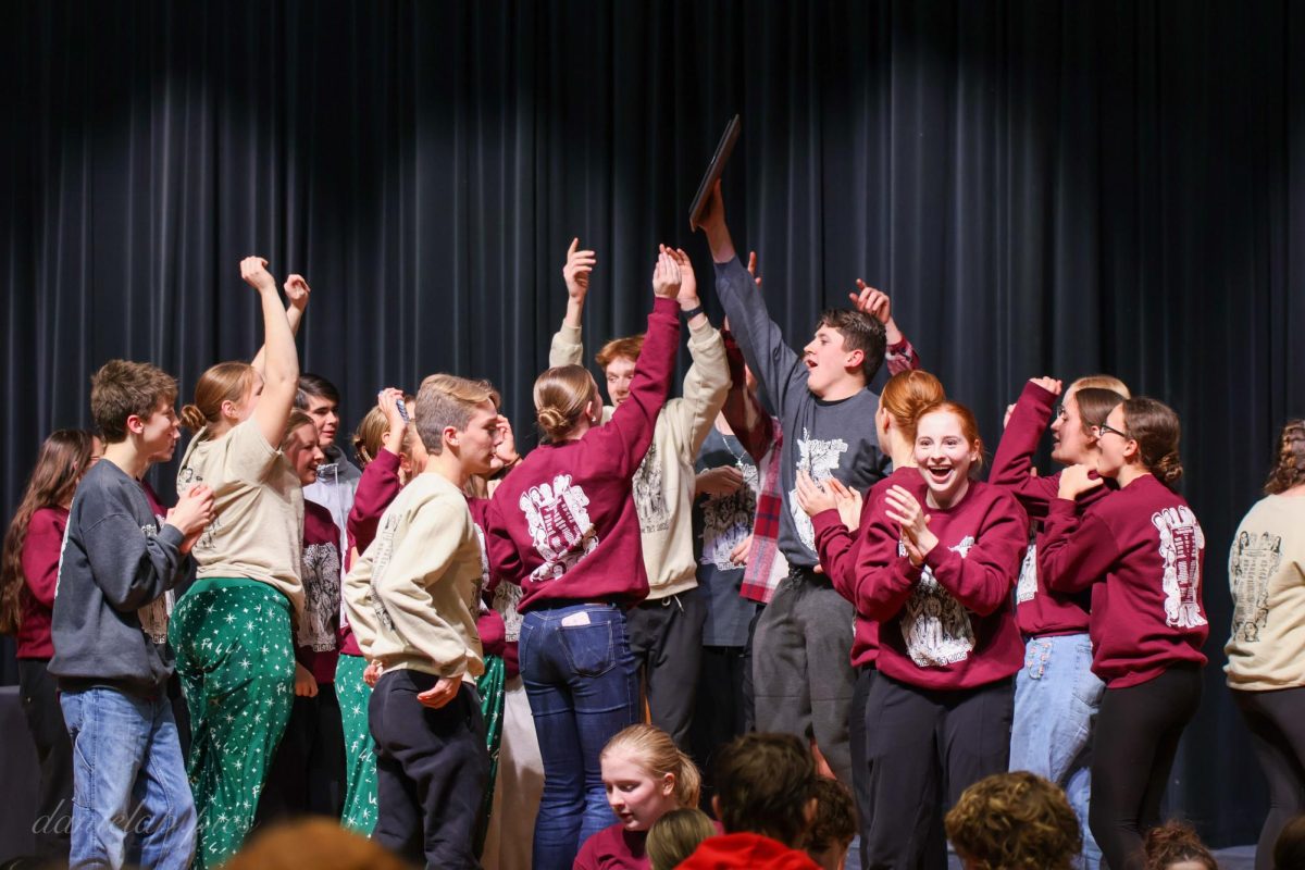 The cast and crew of "The Hangings at Mercy Hollow" celebrate their district championship victory at Gretna High School. "It was mostly line delivery and emotion because we had a couple of spots in the show that were dead emotion wise, but there is always so much to change it feels like," senior Haley Burtwistle said.