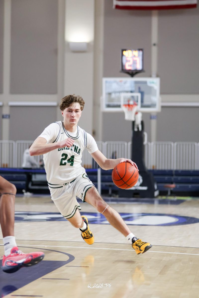 Senior Treven Wilkens drives around the defender and accelerates towards the basket. 