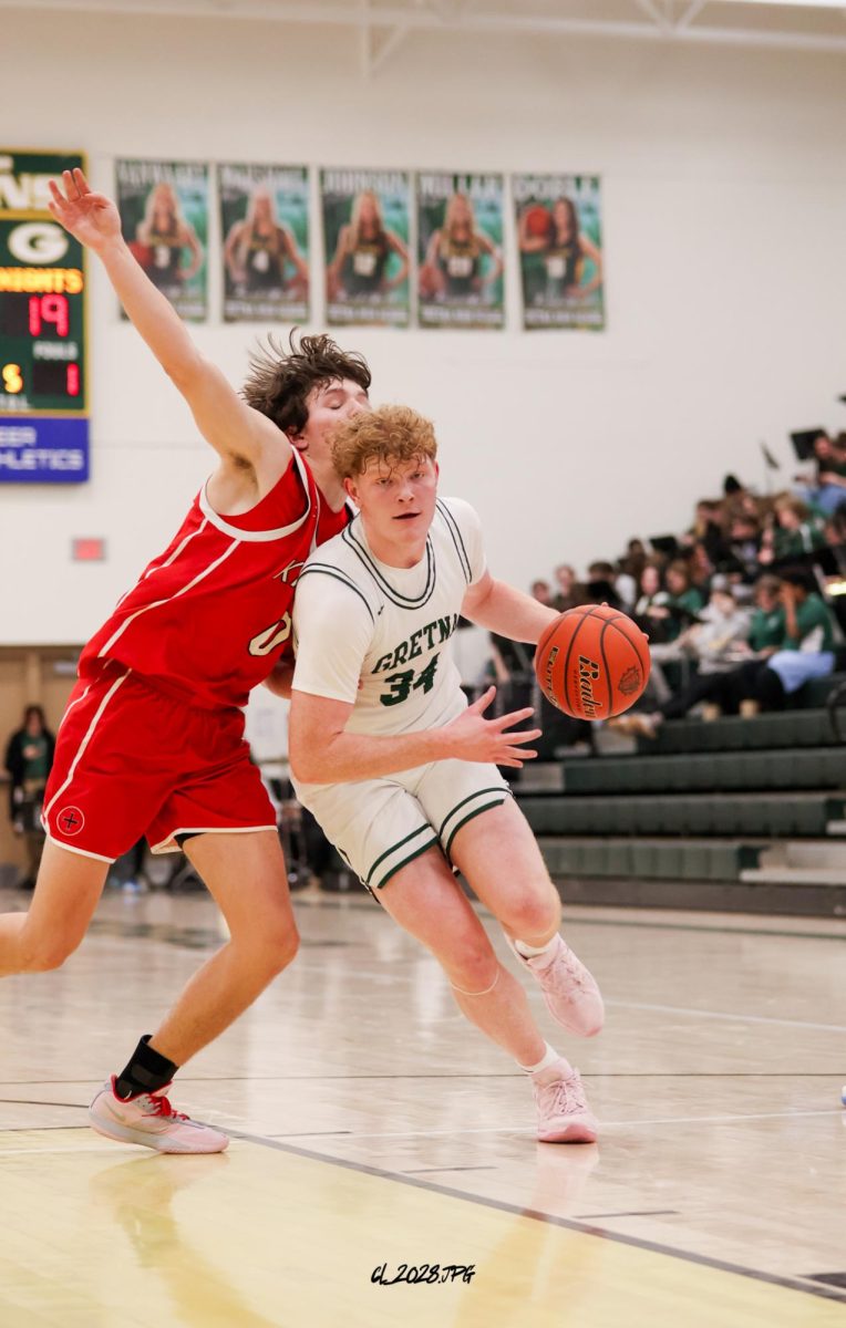 Junior Ethan Zwiebal drives into the post looking to put up a layup to cut the Mount Michael lead.
