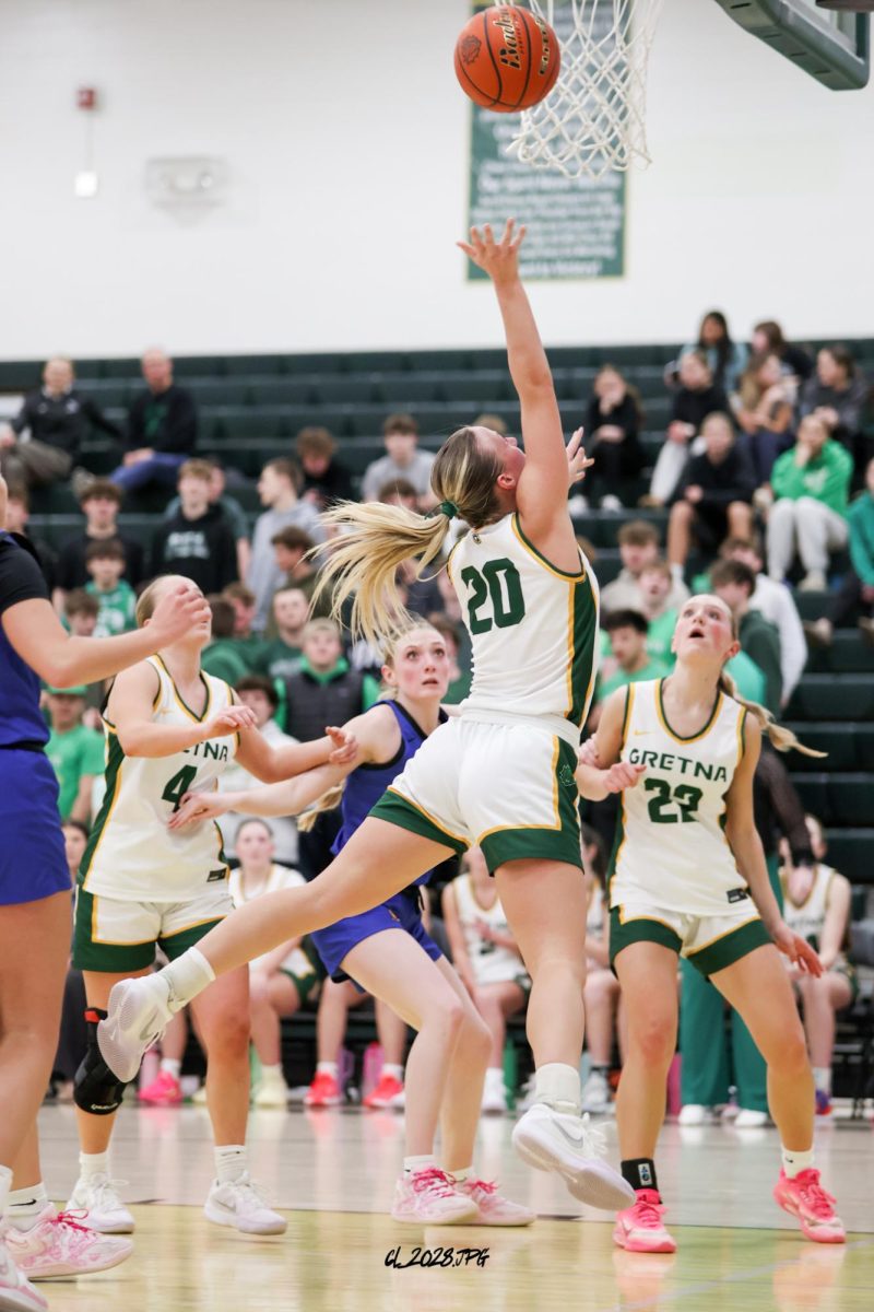 "When I drive to the rim, I am usually thinking just go hard because fouls aren't a guarantee. When I am making that last second adjustment, it is honestly just a skill that has been worked in practice, and I just happened to do it. It's more of a read and react thing," said senior Maggie Miller on how she skillfully drives to the rim.