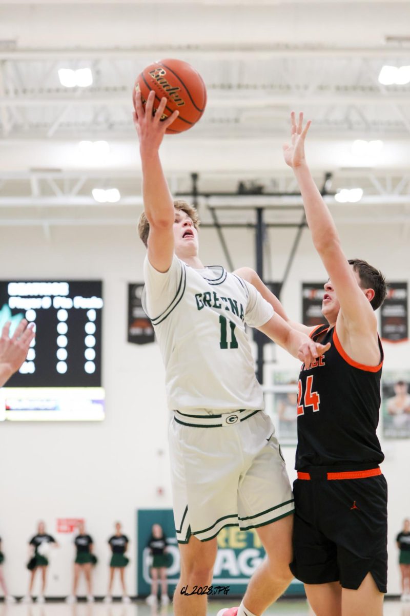 Senior Brandtley Hack drives by his defender and gets physical for a layup.