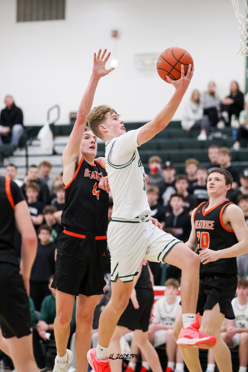Senior Brandtley Hack cuts through the defense, jumps and finishes  through contact to get the layup.