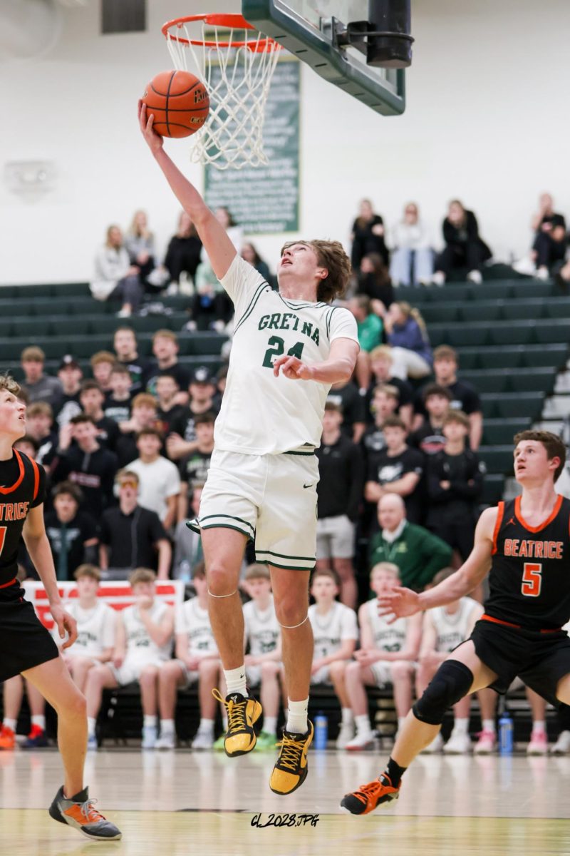 Senior Treven Wilkens droves to the basket and lays it up.