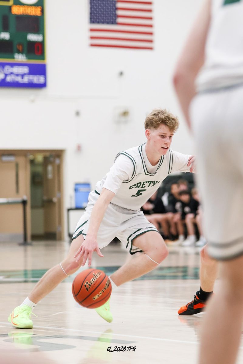 Junior Lucas Hack comes off a ball screen and drives to the hoop.
