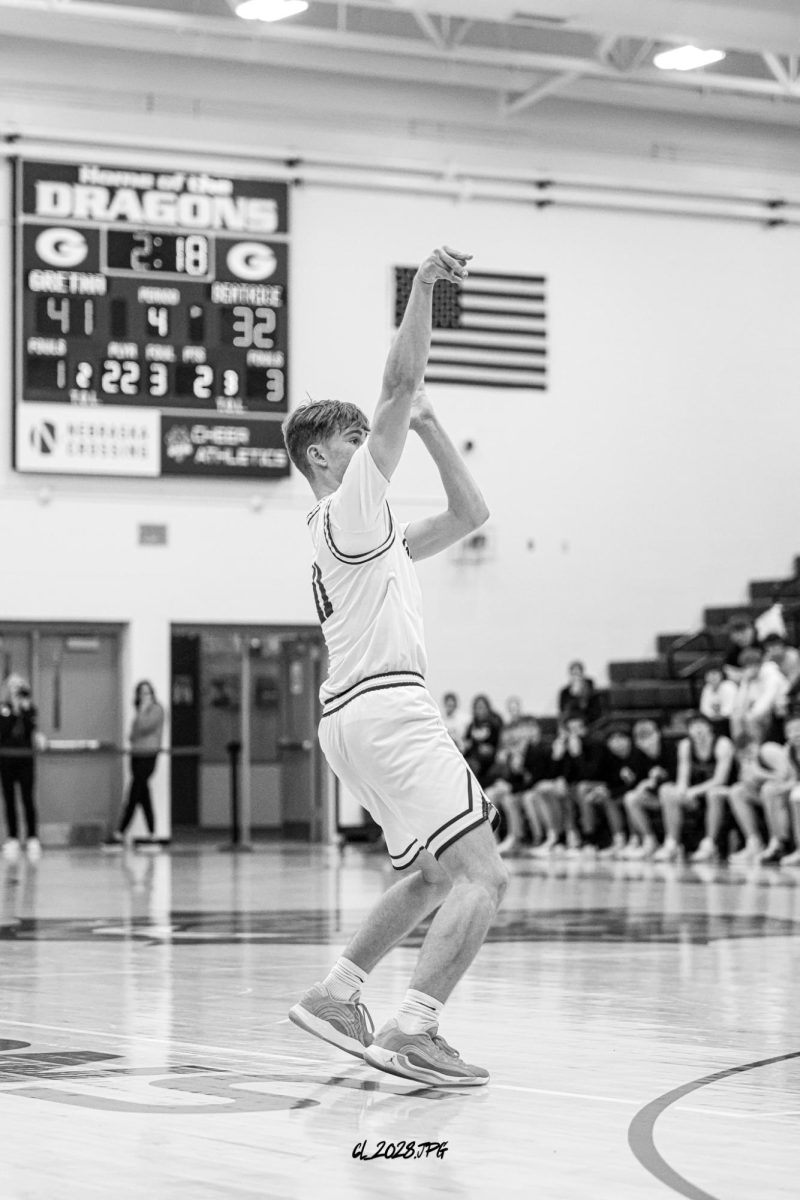 Senior Brandtley Hack shoots the three pointer during Gretna's district semifinal win over Beatrice.