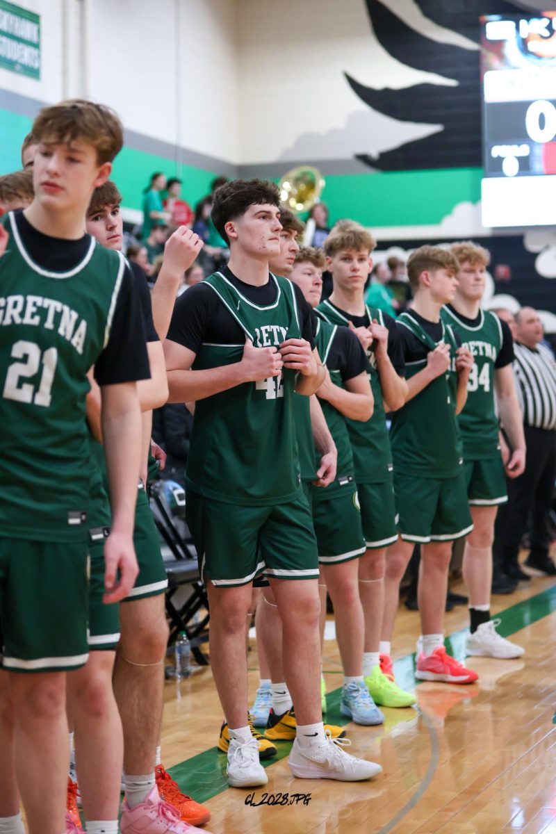 Senior Michael Knudsen waits for the national anthem before Gretna's game vs. Skutt Catholic.
