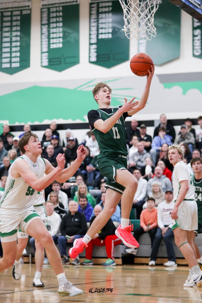 Senior Brandtley Hack makes his defender miss and dribbles freely to the basket.