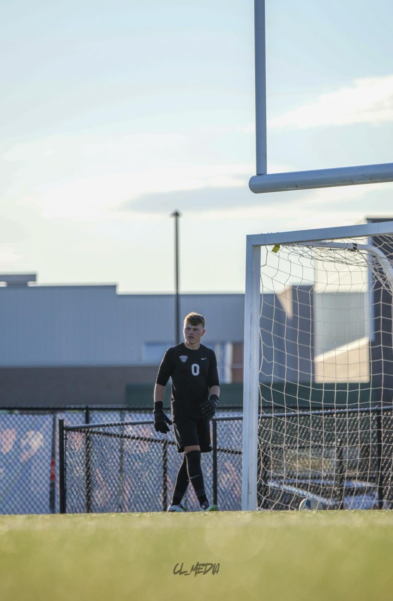 Freshman Grant Stangl patrols Gretna's goal during the District final on May 7. Stangl shut out against the Waverly Vikings. The score ended at 10-0. 