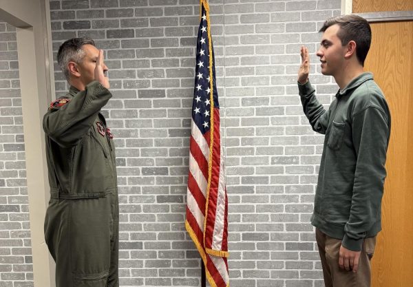 Senior Eli Fuller signed papers that have him on a path to work as airborne systems engineer.  